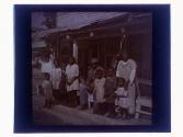 [African American family on porch]