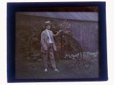 [Charles Zoller next to bicycle]