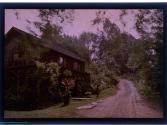 [House along dirt road]