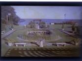 [Park and pond overlooking water]