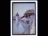 [Covered wooden bridge across river]
