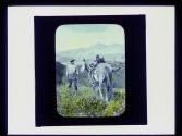 Man leading horse loaded with set of antlers, Newfoundland Trip