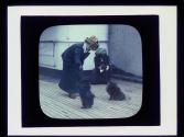 Women with dogs on deck of boat