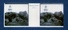 [Woman on ground near lighthouse]