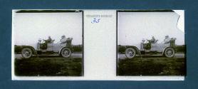 [Man and two women in auto]