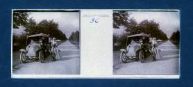 [Woman next to car on roadside]