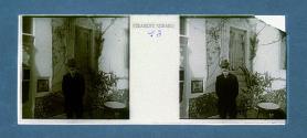 [Bearded man with hat by table and bench]