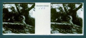 [Unid. woman and man seated on park bench]