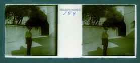 [Unid. man standing in courtyard]