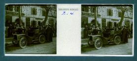 [Three people posing by car]