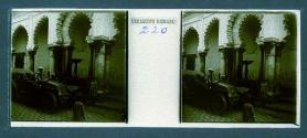 [Three children in street, woman in car]