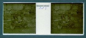 [Two women and two men picnicing on steps]