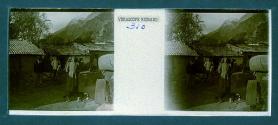 [Woman with goggles by car, man and dog in backround]