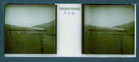 [Train passing through landscape]