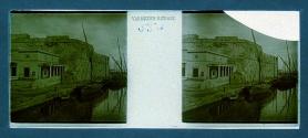 [Boats next to dock and buildings]