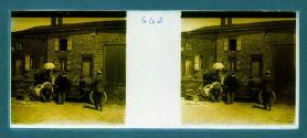 [Woman in car four men changing tire]