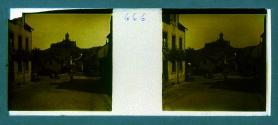 [Village street with view of mountaintop town]