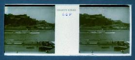 [Paddle-wheel boat on river]
