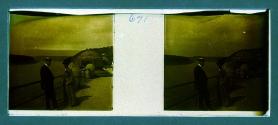 [Man and woman on bridge over water]