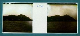 [House on water - mountain in distance]
