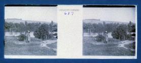 [Young girl in landscape along river]
