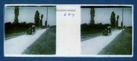 [Car on dirt road]