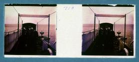 [Three men in uniforms on ship]