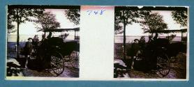 [Man and woman getting in horse and buggy]