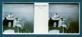 [Woman posing next to capatin(?) of boat]