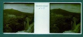 [Unid. woman standing by railing on cliff - mountains in distence]