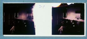 [Three unid. people in ship's cabin]