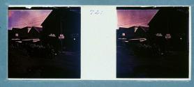 [Car on street of waterfront town]