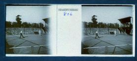 [Two men playing tennis]