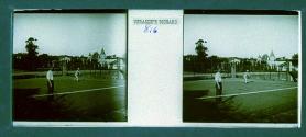 [Two men playing tennis]