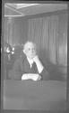George Eastman seated at table with irritated skin, Labrador Trip