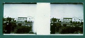 [View of hotel and cars]