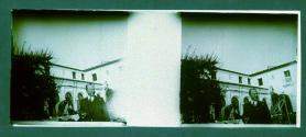 [Man in front of hotel]