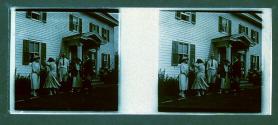 [Unid. people outside house]