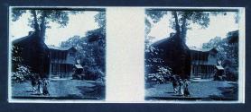 [Three people by house]