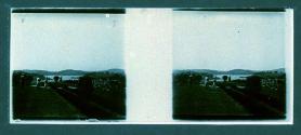 [Three people on road by water]