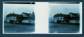 [Building and car by road]