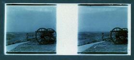 [People near cannon on hill]