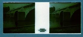 [Man by water and bridge]