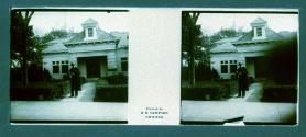 [Man in front of house]