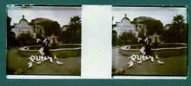 [Woman and birds in front of fountain]