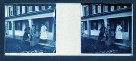 [Two women, one man on porch]
