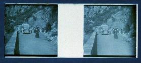 [Unid. group on road by car]