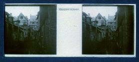 [View of dilapidated buildings from alley]