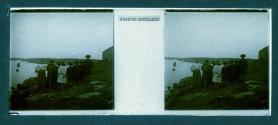 [Children on hill overlooking water]