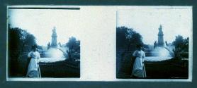 [Woman in front of statue and fountain]